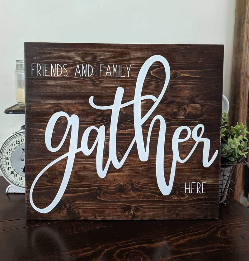 Friends and family gather here solid wood sign